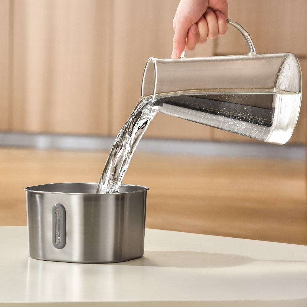 Filling the bowl from a jug